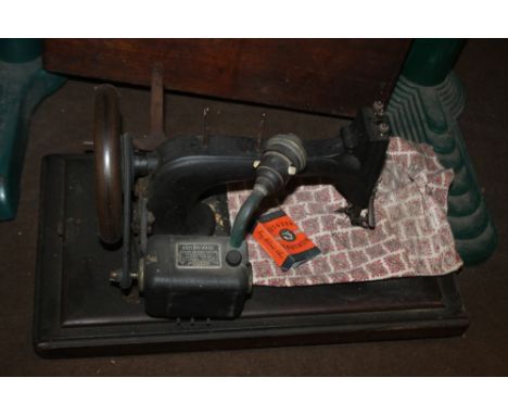 A VINTAGE BRITISH MADE SEWING MACHINE