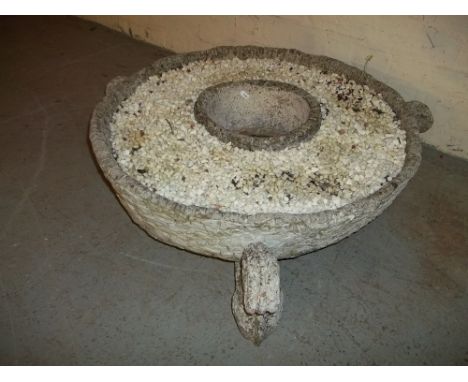 A LARGE PLANTER ON STANDS