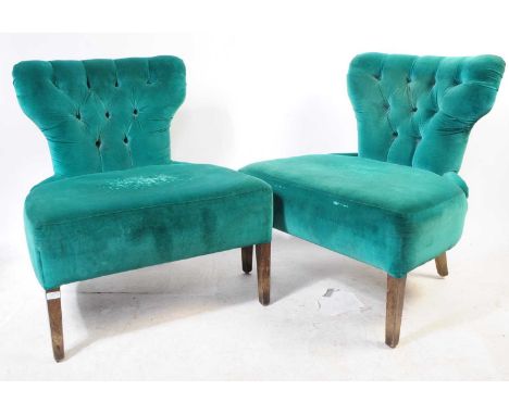 A pair of 20th century contemporary upholstered boudoir armchairs. Raised on tapering squared legs with turquoise blue velvet