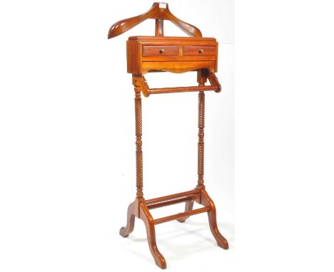 A 20th century gentleman's mahogany vanity stand. Splayed legs with squared uprights having coat hanging top with button tray