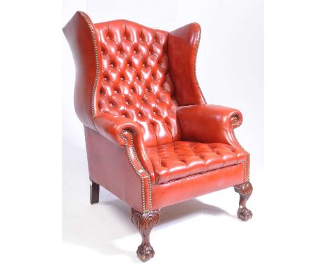 Queen Anne revival wingback chesterfield armchair. The armchair upholstered in oxblood leather, with button back design to ba