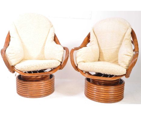 A pair of vintage retro late 20th century bamboo swivel chairs / armchairs / easy chair in the manner of Franco Albini having