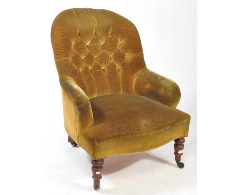 A 19th century Victorian button back lounge armchair in the manner of Howard &amp; Son, London. Green upholstery with curved 