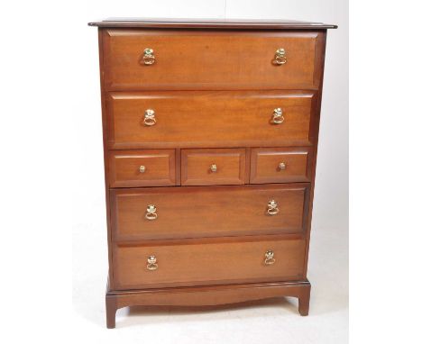 Stag - Minstrel Range - A 20th century makore wood 7 drawer tallboy chest of drawers. Rectangular form with flared edge, two 