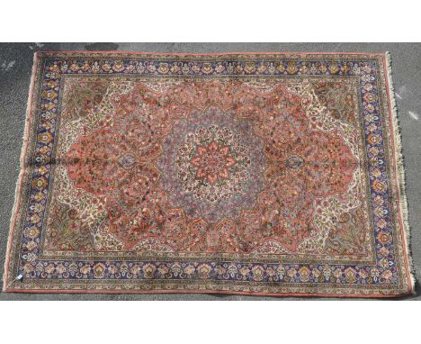 A vintage 20th century Turkish Ladik carpet floor rug. With various size floral central medallions encapsulated in a larger o