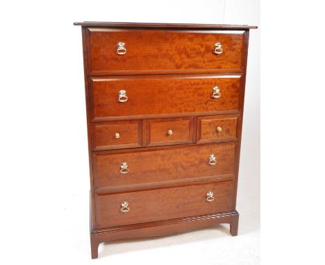 Stag - Minstrel Range - A 20th century makore wood 7 drawer tallboy chest of drawers. Rectangular form with flared edge, two 