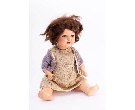 A mid 20th century bisque head doll by Heubach Koppelsdorf: applied wig, blue glass sleeping eyes, open mouth with teeth and 