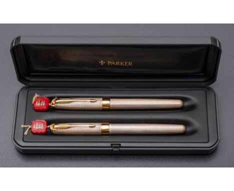 A Parker Sonnet silver pens set: fountain pen and roller ball, in original case: 