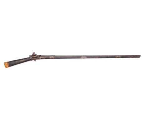 A late 19th century Indo-Persian flintlock musket: the 44 1/2 inch octagonal Damascus barrel with three broad niello work ban