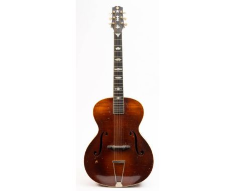 A 1950s German semi-acoustic guitar: unsigned, the shaped headstock with inlaid retailers label for 'Barnes &amp; Mullins, Lo