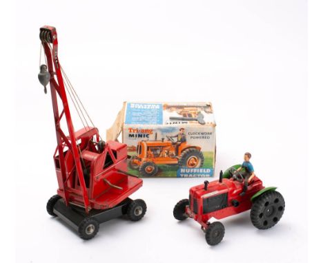 Tri-ang Minic Series II Nuffiled Tractor: red and green plastic with clockwork motor in  illustrated box, together with a Tri
