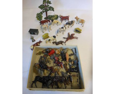 A collection of hollow cast farm animals and figures: all playworn.