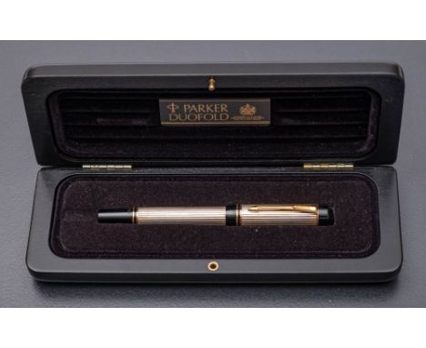 A Parker Duofold sterling silver roller ball pen,: cased.