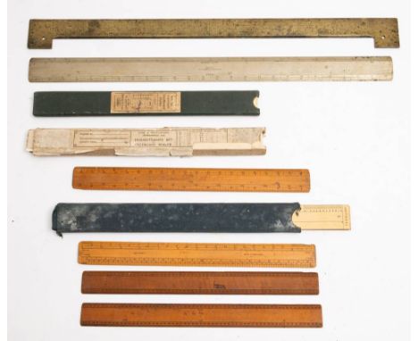 A 19th century brass rule: unsigned, together with a Stanley steel rule and a collection of boxwood and cardboard  scales.