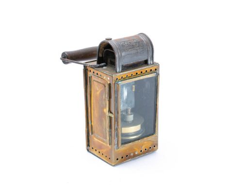 A WWII period German tinplate railway lamp by Helmholz &amp; Pauli, Frankfurt:  rectangular body with burner to interior, sta