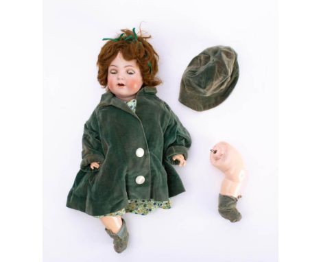 A Simon and Halbig bisque head doll,: applied brown wig, blue glass sleeping eyes, open mouth with teeth and painted face, ma
