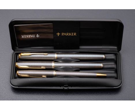 A Parker Sonnet 'Essence Du Papier' pen set in Cisele silver pattern,: fountain pen, ball pen and roller ball, cased.