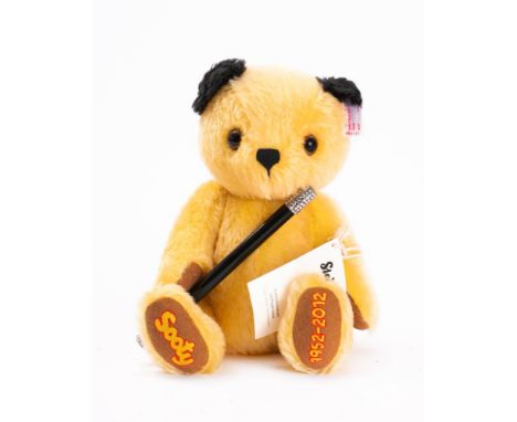 A Steiff 'Sooty' limited edition bear No 386: yellow with black ears, ear stud and tag over jointed body and holding wand, to