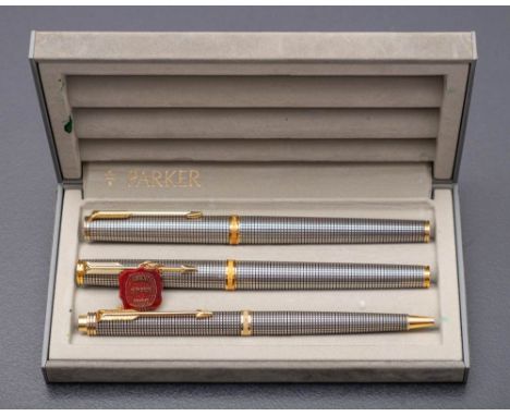 A Parker sterling silver pen set in Cisele finish, fountain pen with 18k gold nib, ball pen and roller ball pen. 