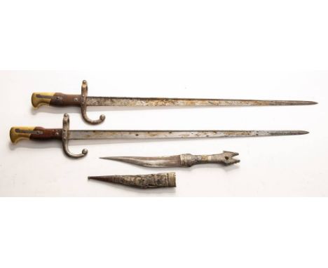 Two WWI St Etienne pattern bayonets: together with an Indian white metal mounted dagger (3)