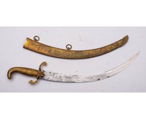 A Georgian gilt brass mounted dagger: the short curved clipped back blade with acid etched militaria and foliate dejection wi