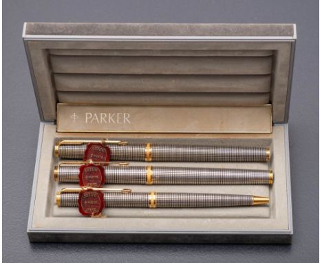 A Parker sterling silver pen set in Cisele finish, fountain pen with 18k gold nib, ball pen and roller ball pen. 