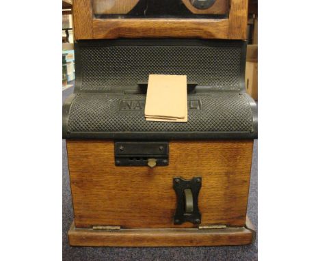 An oak cased 'National Electric' time clocking in clock by the National Time Recorder Co, London': Arabic numeral chapter rin