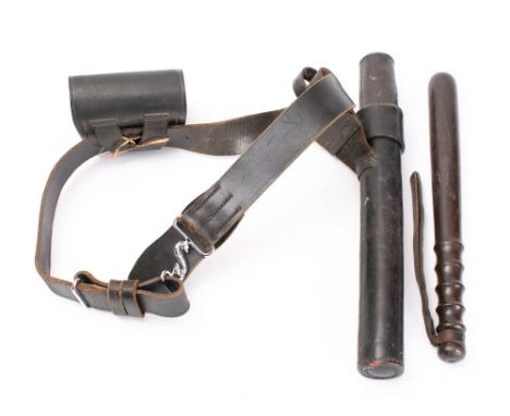 A Royal Ulster Constabulary black leather belt rig: with truncheon in pouch, ammunition pouch and nickel plated mounts. 