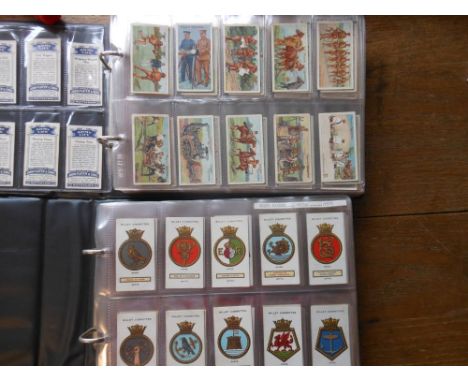 Wills, Players and others, assorted sets of cigarette cards:- sets include Ships Badges, Flags of The Empire, Naval Uniforms,