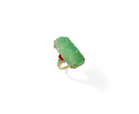 An early 20th century jadeite jade and enamel ring The pierced jadeite jade plaque carved with a floral motif, between tiered