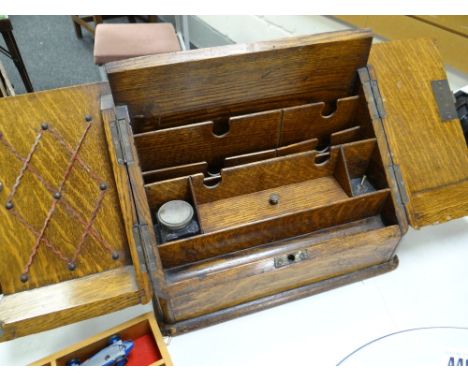 A vintage oak slope front compartmented stationary cabinet Condition reports provided on request by email for this auction ot