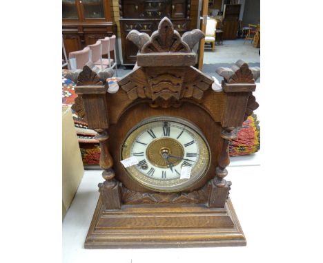 A vintage carved table clock Condition reports provided on request by email for this auction otherwise items purchased `as se