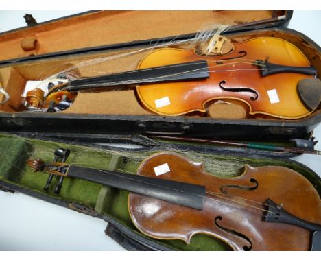 A vintage Czechoslovakian cased violin &amp; bow together with a smaller cased violin &amp; bow (both distressed) Condition r