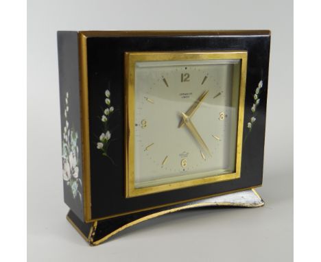 A vintage Elliott Clock ebonized and floral painted table clock Condition reports provided on request by email for this aucti