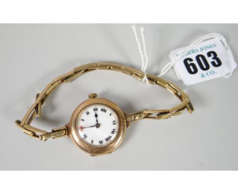 A vintage 9ct encased ladies wristwatch with white enamel dial &amp; Roman numerals Condition reports provided on request by 