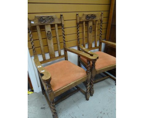 A pair of carved Art Nouveau-style decorated barley-twist and splat back oak armchairs with drop in upholstered seats Conditi