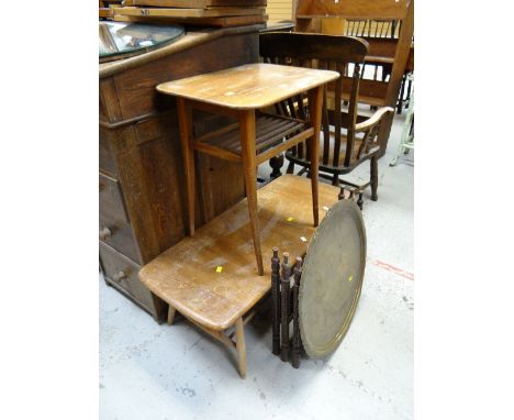 An Ercol lightwood two-tier Long John coffee table (distressed), a brass Benares folding table, mid-century tea trolley and t