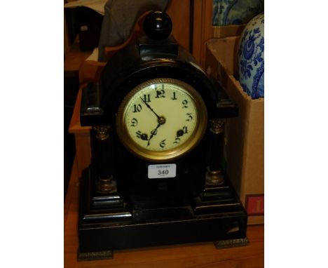An American black Japanned iron mantel clock