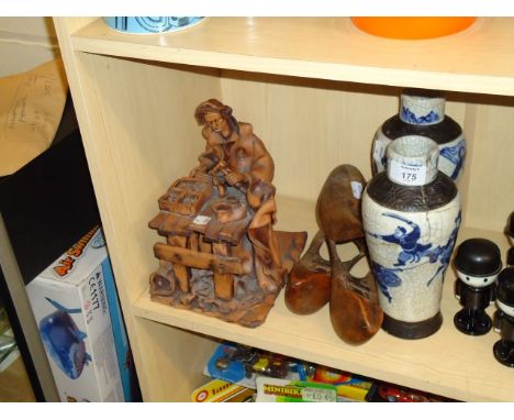 A pair of 19th century Chinese crackle glazed vases (one AF), a clay figure of a cobber at his bench and a pair of shoe trees