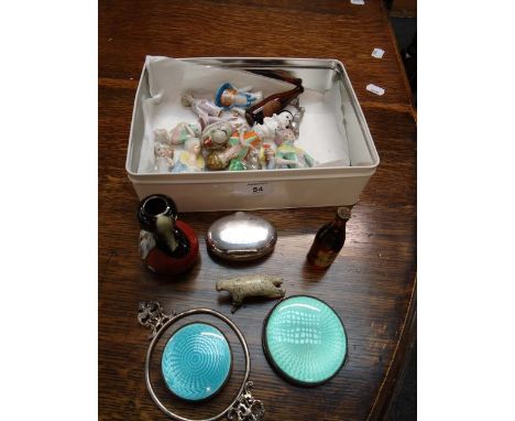 An oval silver snuff box with spring lid, together with two circular silver powder compacts with guilloche enamel (3) and a s