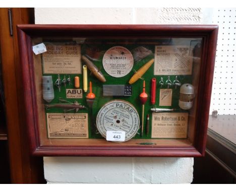 A collection of vintage fishing tackle, displayed in a mahogany stained glazed case, 25.5 x 36cm