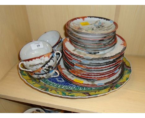 An early 20th century Japanese eggshell part tea service, hand decorated with figures, interiors and landscapes, together wit