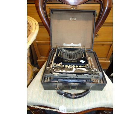 An early 20th century Corona number 3 folding typewriter, in a period hinged case