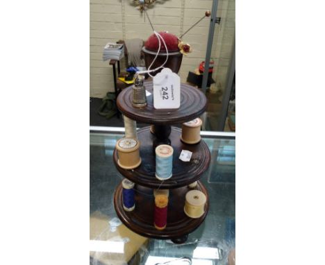 A 19th century mahogany cotton stand of three circular tiers with pin cushion finial on bun feet, together with a Victorian p