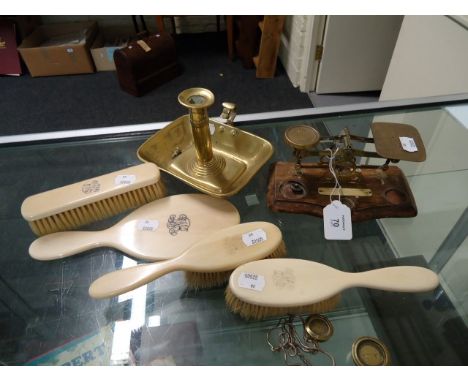 A George IV rectangular brass chamber candlestick, postal scales and ivory handled dressing table appointment set