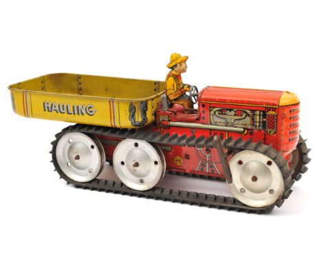 An impressively large MARX clockwork heavy duty 6 wheeled crawler tractor. 36cm overall, tractor in red with litho engine det