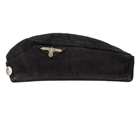 A very scarce Third Reich OR’s Allgemaine SS black feldmutze complete with death’s head button and woven eagle, original labe