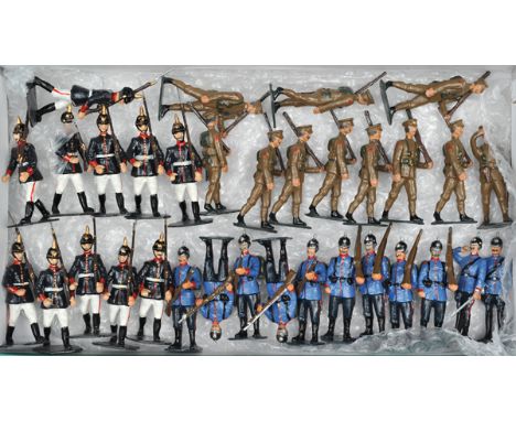 33 white metal soldiers. German WW1 infantry wearing pickelhaubes. In light blue tunics, dark blue trousers, 2 Officers one w
