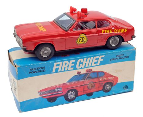 A mid 1970’s Sonokong (Korean) Ford Capri Fire Chief’s car. A friction powered example in bright red with interior and light 