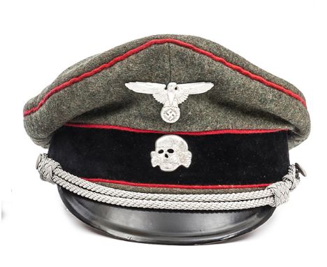 A scarce Third Reich Officer’s Waffen SS artillery peaked cap, field grey body with red piping, black velvet band, light tan 